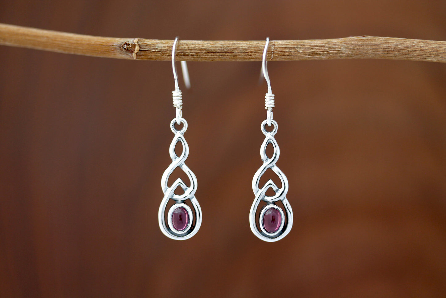 Celtic Knot Earrings - Interlocked Arms with Red Garnet