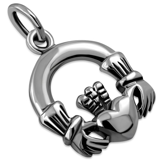 A silver Claddagh pendant featuring the iconic design of two hands holding a heart with a crown on top.
